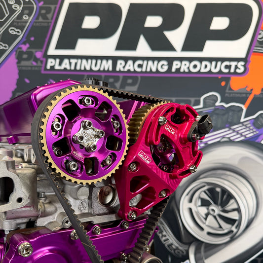 Close-up of purple and red engine components with PRP Platinum Racing Products branding in the background.