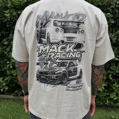 Person wearing a t-shirt with car graphics and 'Mack Racing' text.